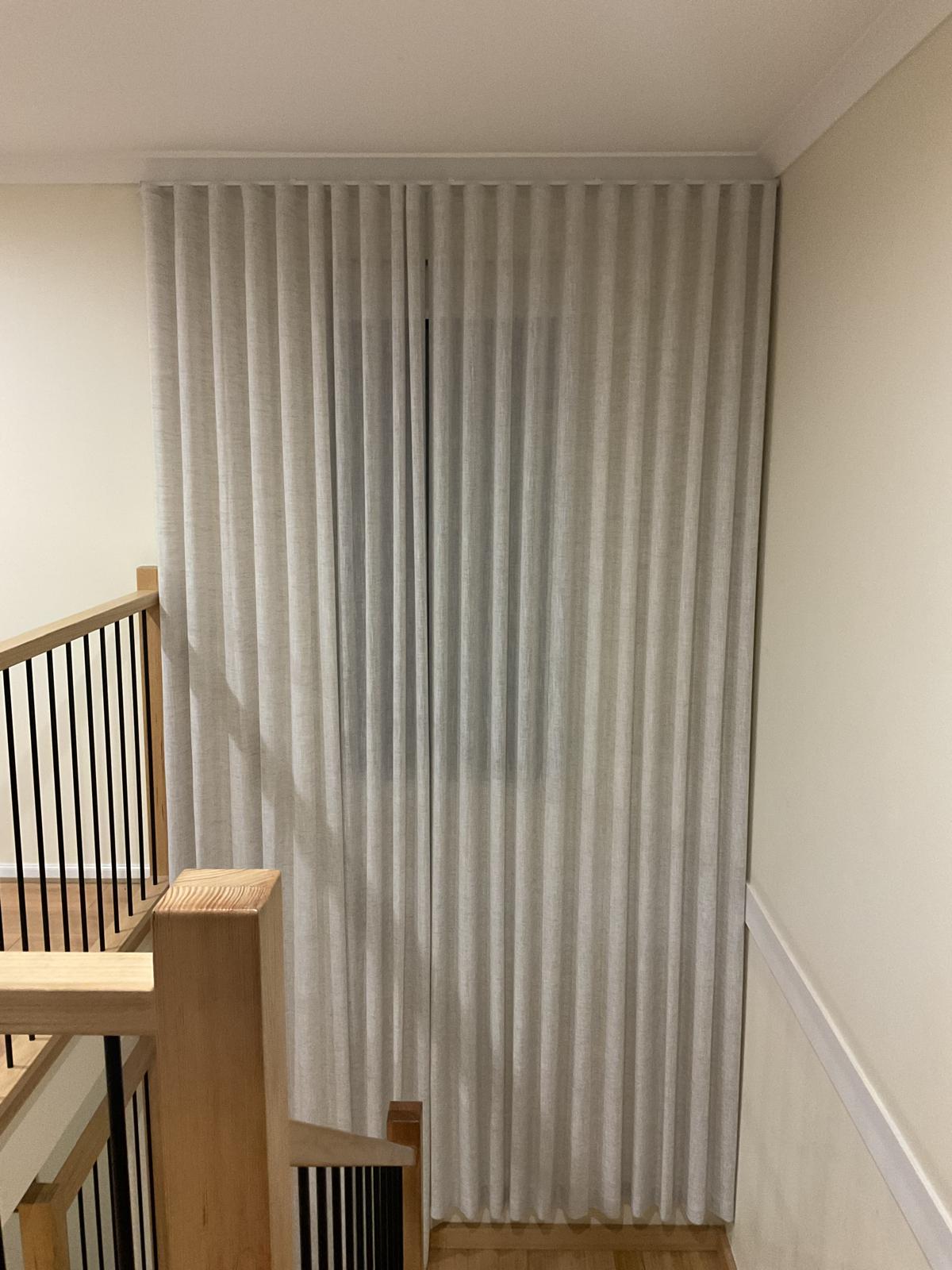 Full-height sheer curtain installation
