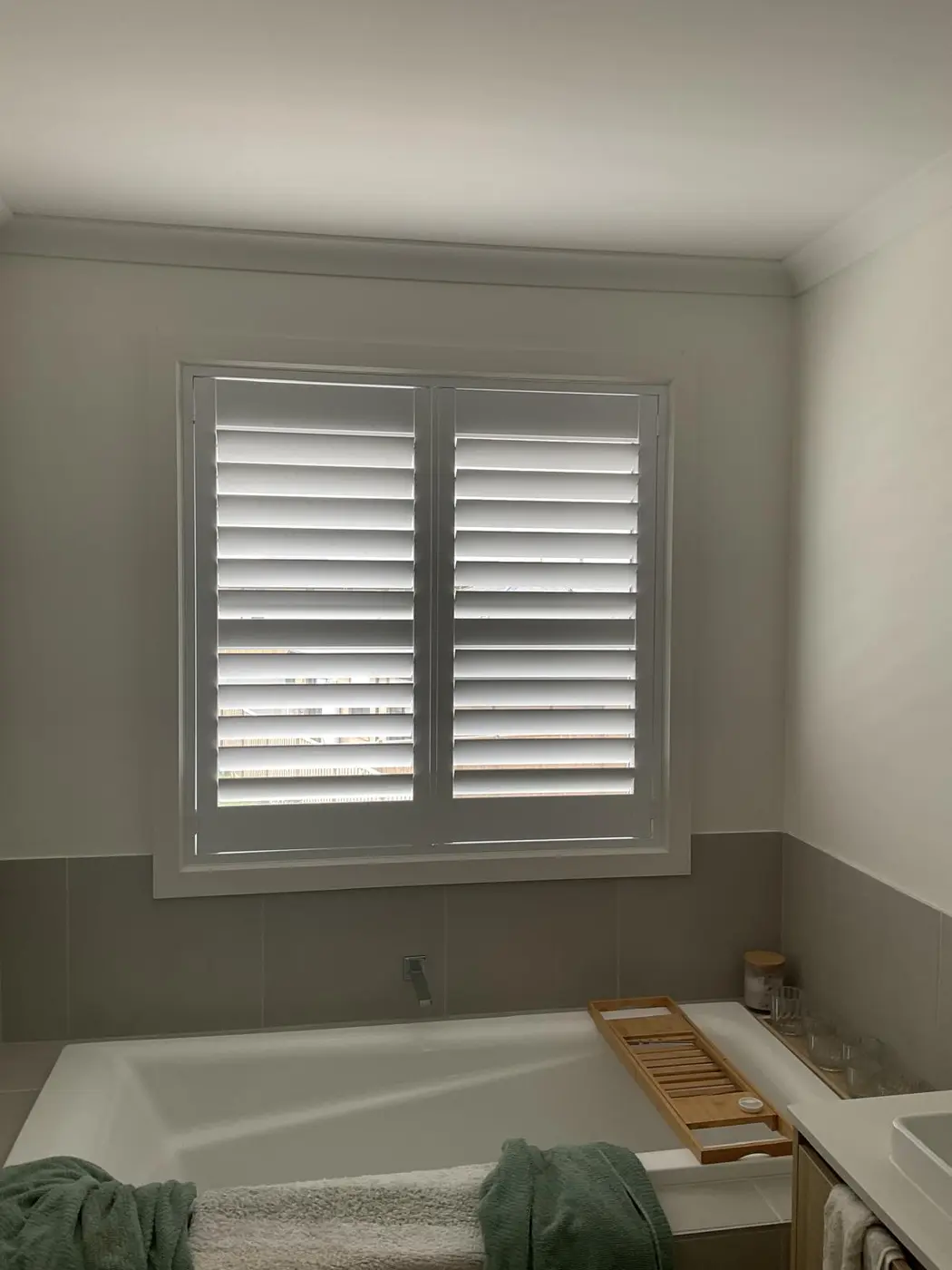 Plantation shutters installed in a Melbourne bathroom