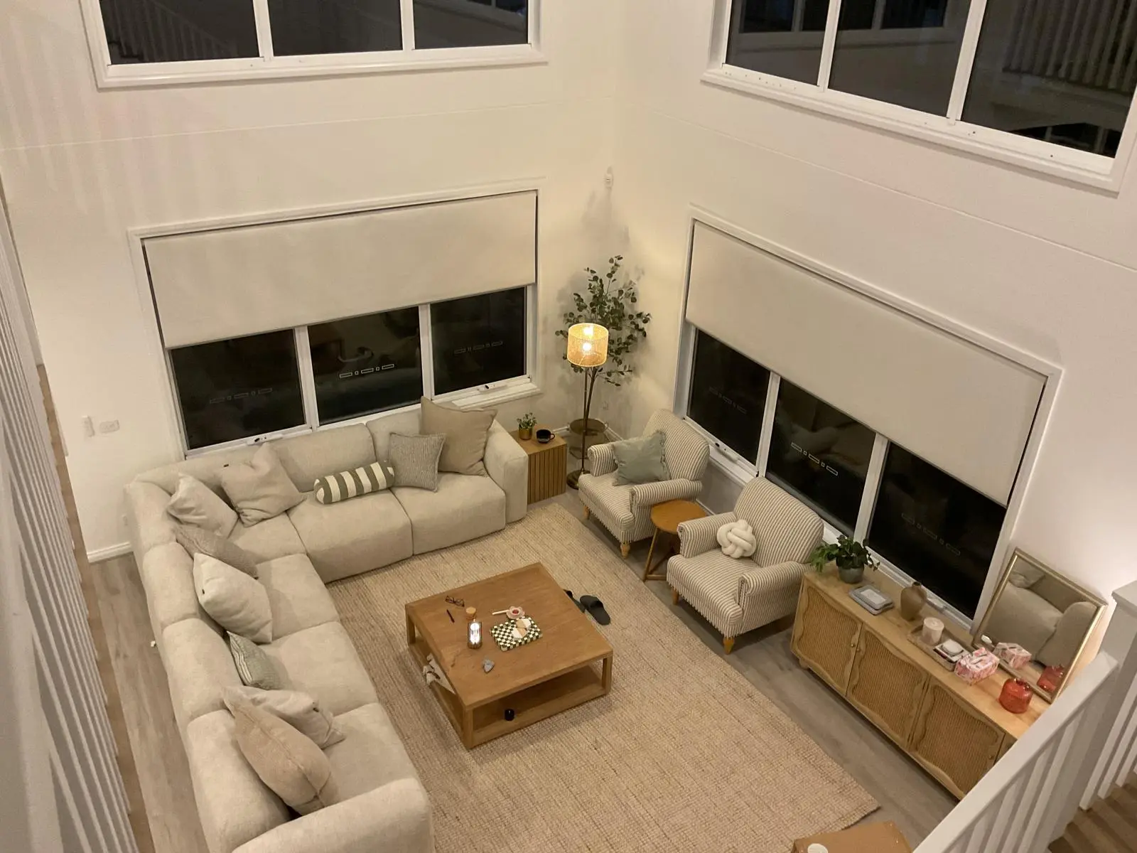 Blackout roller blinds viewed from above in a double-height Melbourne living room