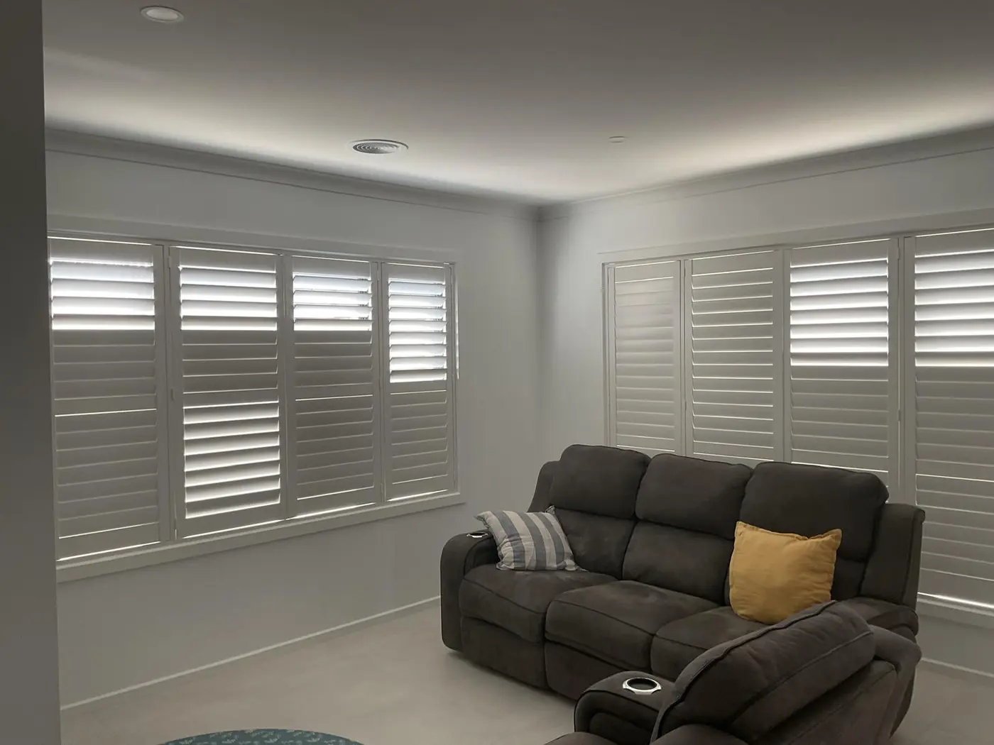 Plantation shutter installation in a Melbourne home theatre