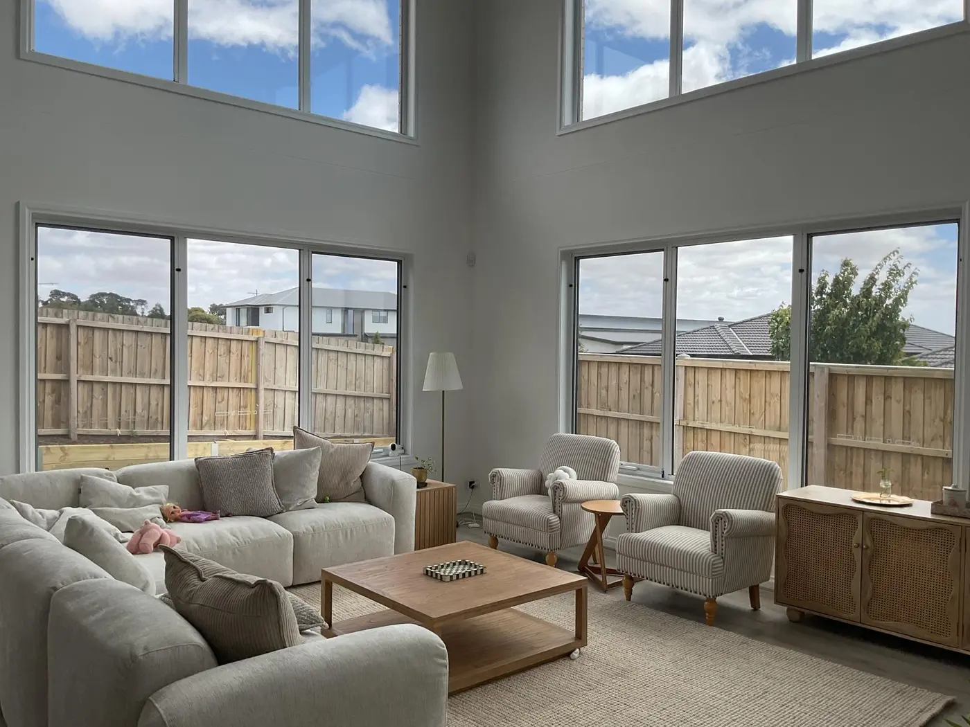Double-height living room before roller blind installation