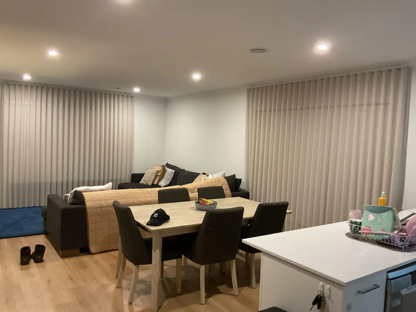 Floor-to-ceiling sheer curtains installed in a Melbourne family room